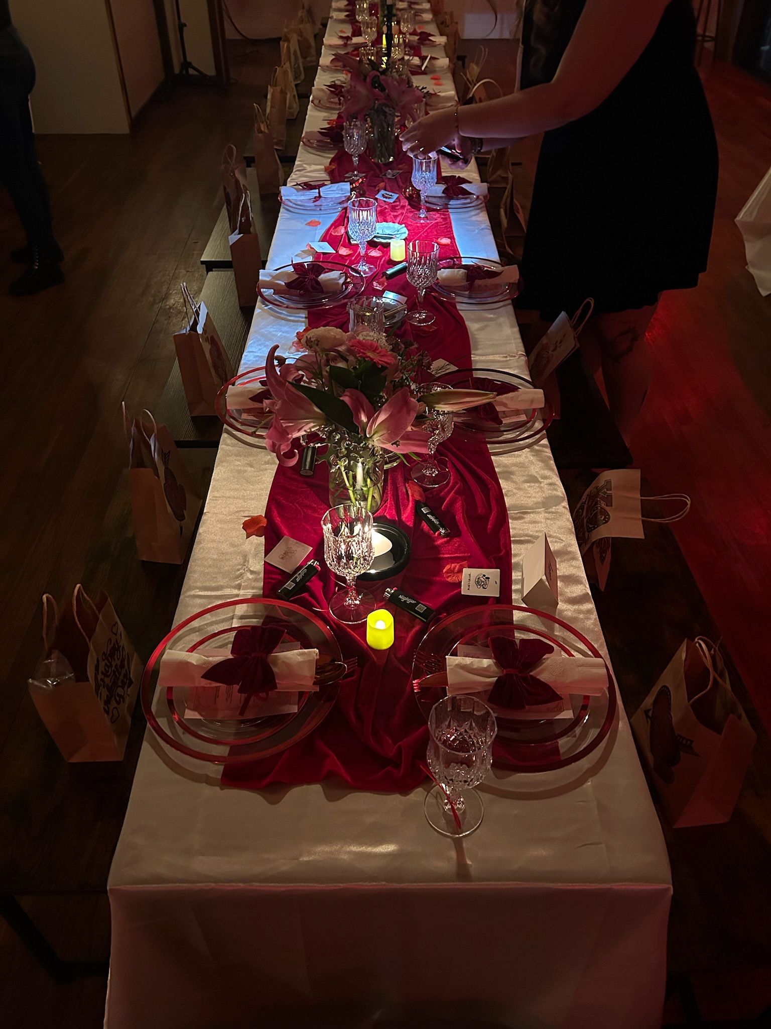 Long red and white dinner tablescape inside brwnbox